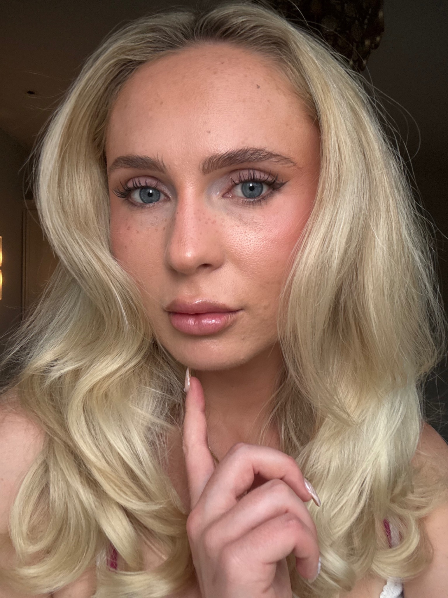 Augusta demonstrating her signature beauty look